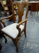 AN EARLY 20th.C.OAK DESK ARMCHAIR ON CABRIOLE FORELEGS WITH CARVED PAW FEET.