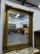 AN IMPRESSIVE GILT FRAMED MIRROR. 154 x 124cms.