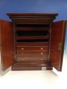 A VICTORIAN MAHOGANY COLLECTOR'S CABINET IN THE FORM OF A MINIATURE WARDROBE WITH TWIN PANEL DOORS