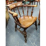 A SMOKERS BOW CHAIR, THE BACK WITH TURNED SUPPORTS, BALUSTER FRONT LEGS