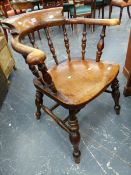 A SMOKERS BOW CHAIR, THE BACK WITH TURNED SUPPORTS, BALUSTER FRONT LEGS