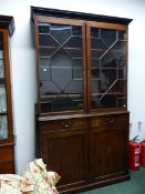 A 19th.C.MAHOGANY BOOKCASE WITH TWIN ASTRAGAL GLAZED DOORS OVER TWO DRAWERS AND PANEL DOORS,