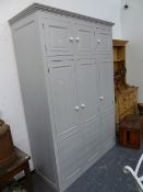 A LARGE PAINTED PINE HALL CUPBOARD OR WARDROBE WITH ARRANGEMENT OF SIX PANEL DOORS. 145 x 60 x H.