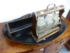 A VICTORIAN THREE BOTTLE TANTALUS, A SHAPED PAPIER MACHE TRAY AND AN ORIENTAL WOODEN BOX. (3)