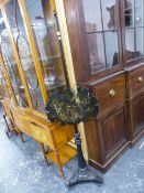 AN EBONISED POLE SCREEN ON TRIPARTITE BASE, THE ADJUSTABLE SCREEN OF SHAPED PAPIER MACHE INLAID WITH