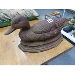 A CAST IRON DUCK FORM DOOR STOP.