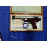 A BOXED GERMAN ORIGINAL AIR PISTOL CAL 5.5/.22 WITH ADJUSTABLE SIGHTS AND BROWN PLASTIC GRIP.