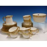 A LATE 19th C. MINTON G7576 PATTERN PART TEA SERVICE, EACH OF THE SWIRL FLUTED PIECES GILT WITH