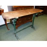 AN ANTIQUE PAINTED CAST IRON BASED GARDEN TABLE WITH RECTANGULAR TOP. W.102cms.