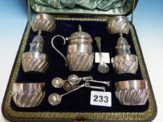 A SILVER HALLMARKED CASED CONDIMENT SET TO INCLUDE TWO PEPPERS, FOUR SALTS AND A MUSTARD POT.