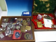 A COLLECTION OF ARMED FORCES AND POLICE BADGES AND INSIGNIA.