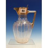 A SILVER MOUNTED CUT GLASS CLARET JUG BY WALKER AND HALL, SHEFFIELD 1899, THE OVOID BODY CUT WITH