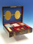 A VICTORIAN CORAMANDEL AND GILT BRASS MOUNTED GAMES COMPENDIUM FITTED FOR VARIOUS CARD, DICE AND