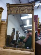 AN ANTIQUE GILT FRAMED PIER MIRROR WITH DECORATIVE UPPER FRIEZE. 60 x 95cms.