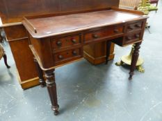 A 19th.C.MAHOGANY WRITING TABLE, THE THREE QUARTER GALLERIED RECTANGULAR TOP OVER FIVE APRON