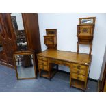 AN ASH VICTORIAN DRESSING TABLE, THE RECTANGULAR BEVELLED GLASS MIRROR IN BROKEN ARCHED FRAME, THE