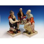 A PAIR OF STAFFORDSHIRE POTTERY COBBLER AND TOPER FIGURES ON SQUARE BASES. H.31cms. TOGETHER WITH