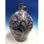 A LARGE GERMAN BLUE GLAZED POTTERY BELLIED FLAGON. H.49cms.