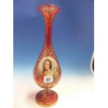 A BOHEMIAN GILT CRANBERRY GLASS BALUSTER VASE PAINTED WITH A RAISED OVAL OF A LADY. H 36cms.