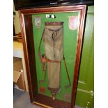 A VINTAGE GOLFING DISPLAY OF EARLY 20th.C.BAG & CLUBS, CRESTED CLUB SHIELD AND A TROPHY IN A