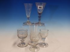 AN EARLY EUROPEAN SODA GLASS WINE, THE ENGRAVED CONICAL BOWL ABOVE FOLDED FOOT. H 14cms. THREE