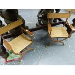 A PAIR OF CHILDREN'S GARDEN CHAIRS, THE DEAL BACKS, ARMS AND SEATS SUPPORTED ON IRON STRAPS WITH