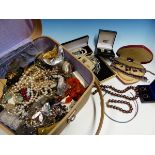 A SMALL SUITCASE OF COSTUME AND SILVER JEWELLERY.