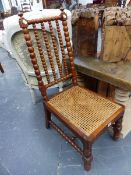 A PAIR OF VICTORIAN BOBBIN TURNED CHAIRS WITH CANED SEATS BELOW FOUR BAR BACKS.