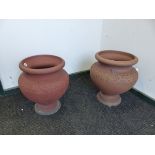 A PAIR OF HATHERN STATION CO. LTD. RED TERRACOTTA PLANTERS A CIRCULAR BAND OF FLOWER HEADS ON THE