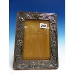 A CHESTER SILVER MOUNTED ART NOUVEAU OAK PHOTOGRAPH FRAME.