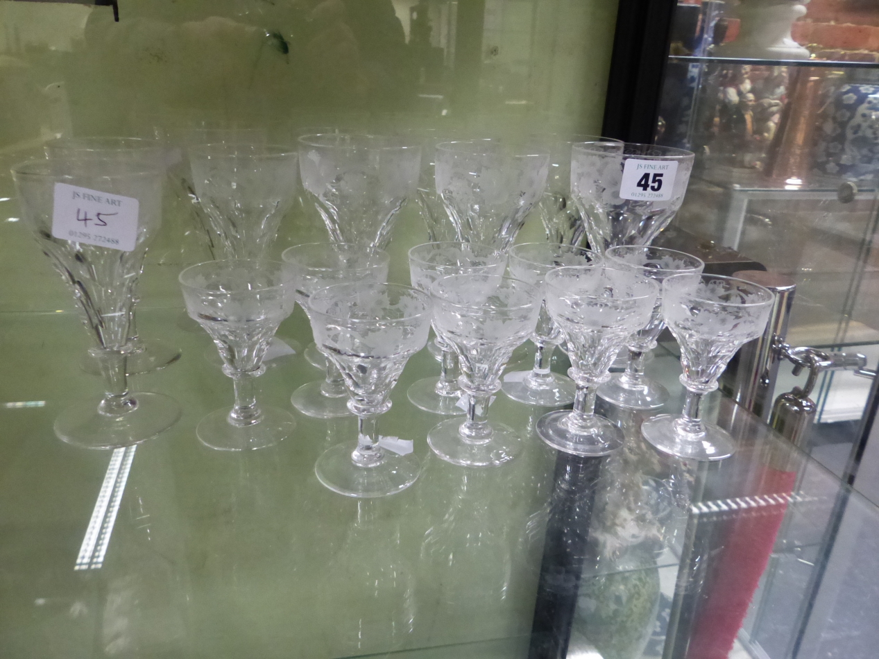 A CLEAR GLASS PART DRINKING SUITE, EACH CONICAL BOWL ENGRAVED WITH GRAPES ABOVE FACETTING, DISC - Image 2 of 2