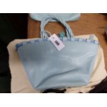 A RADLEY SKY BLUE LEATHER BUCKET SHAPED BAG, THE THREE TWIST HANDLES ATTACHED TO THE RIM THREADED