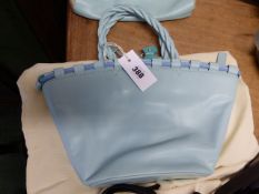 A RADLEY SKY BLUE LEATHER BUCKET SHAPED BAG, THE THREE TWIST HANDLES ATTACHED TO THE RIM THREADED