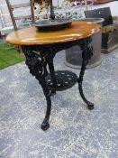 A CAST IRON BASED MAHOGANY TOP PUB TABLE. Dia.61cms TOGETHER WITH A SMALL BENTWOOD CHILD'S CHAIR. (