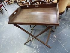 A VICTORIAN BUTLER'S TRAY ON FOLDING STAND.