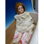A SIMON AND HALBIG BISQUE HEADED DOLL WITH FIXED OPEN EYES AND MOUTH, HER NECK NUMBERED 10, HER