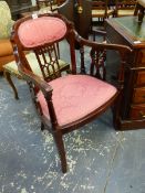 A PAIR OF EDWARDIAN SALON ARMCHAIRS WITH FRET CUT SHOW FRAMES.