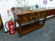 AN EARLY 20th.C.OAK POTBOARD DRESSER BASE WITH TWO DRAWERS ON BOBBIN TURNED LEGS. 130 x 56 x H.