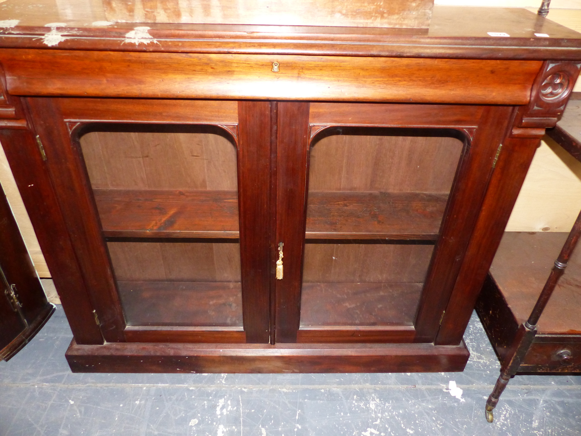 A MAHOGANY SIDE CABINET, THE RECTANGULAR TOP OVER A DRAWER WITH SHAPED FRONT AND BETWEEN TREFOIL