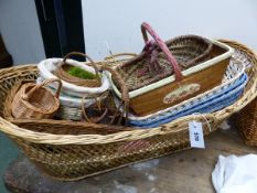 A LARGE COLLECTION OF VARIOUS BASKETS OF DIFFERENT SIZES AND SHAPES.