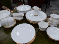 A ROYAL ALBERT VAL D'OR GILT AND WHITE TEA AND DINNER SERVICE FOR SIX.