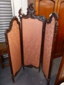 AN EDWARDIAN THREE FOLD SCREEN WITH CARVED SHOW FRAME. H.170cms.