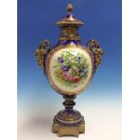 A SEVRES STYLE JEWELLED BLUE GROUND BALUSTER VASE AND COVER PAINTED WITH A ROUNDEL OF A GENTLEMAN