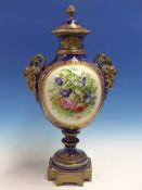 A SEVRES STYLE JEWELLED BLUE GROUND BALUSTER VASE AND COVER PAINTED WITH A ROUNDEL OF A GENTLEMAN