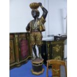 A PAIR OF ANTIQUE CARVED LARGE BLACKAMOOR FIGURES ON PLINTH BASES WITH WELL DETAILED PAINTED
