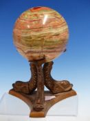 AN AGATE BALL ON BRONZE STAND OF THREE DOLPHINS, THE BALL Dia.10cms.