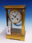 A FRENCH GILT METAL MOUNTED BEVELLED GLASS CASED MANTLE CLOCK STRIKING ON A COILED ROD, THE