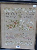 A SILK WORK SAMPLER CELEBRATING THE END OF WORLD WAR I WITH A VERSE, FLOWERS, A LION AND FIGURES.