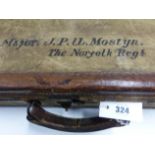 AN ARMY AND NAVY LEATHER TRIMMED KHAKI CANVAS AMMUNITION CASE, THE INTERIOR WITH SIX LEATHER