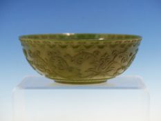 A CHINESE SPINACH GREEN HARDSTONE BOWL, THE EXTERIOR WITH RUYI LAPPET RIM BAND ABOVE TWO LOTUS